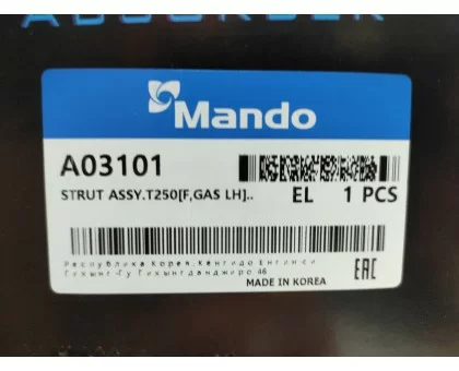 Передній лівий газомасляний амортизатор Mando (A03101) на Chevrolet Aveo (2002-2010) Передній лівий газомасляний амортизатор Mando (A03101) на Chevrolet Aveo (2002-2010)