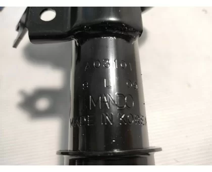 Передній лівий газомасляний амортизатор Mando (A03101) на Chevrolet Aveo (2002-2010) Передній лівий газомасляний амортизатор Mando (A03101) на Chevrolet Aveo (2002-2010)